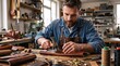© Vasiliy - Male artisan working with leather at a wooden workbench. Craftsman using a hammer and punch tool in a well-lit workshop. Handmade leathercraft small business concept