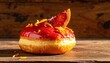 © Agusstudio - A Vibrant Blood Orange Doughnut with Rich Glaze and Candied Peel, Presented on a Wooden Surface