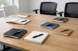 © Ardi - Clean Minimalist Meeting Room with Notebooks and Pens on Wooden Table Ready for Work