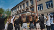 © Довидович Михаил - Group of happy students waving goodbye to school on the last day, celebrating the end of school year