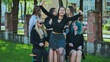 © Довидович Михаил - Happy female students celebrating the end of the school year outdoors during their free time after school