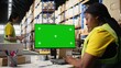 © DC Studio - Warehouse worker in a hi vis vest uses copy space display with shipping software technology, packaging systems and inventory management tools. automation in e-commerce logistics. Camera A.