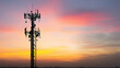 © Alexander - Wireless communication infrastructure tower silhouetted at sunset with multiple antennas Industrial telecommunication tower with multiple antennas and satellite receivers standing