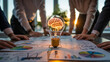 ©  TOFEL - Business team brainstorming with creative idea light bulb