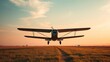 © lebron james - monoplane. Vintage monoplane taking off from a grassy airstrip at dawn against a vast sky. mobility guides, transit brochures, designed for mobility and urban transit guides, used by store managers.