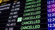 © TechNova Graphics - Closeup of a flight information display board showing multiple cancelled flights