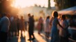 © Oleh - Blurred people moving and dancing outdoors during a sunset celebration, creating an abstract and vibrant atmosphere perfect for concepts of joy, movement, and social gatherings