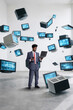 © Lustre Art Group  - Business professional using laptop among floating retro computer monitors showing digital data. Concept of technology evolution, digital transformation, data networks and information systems.