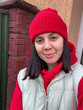 © phpetrunina14 - Winter street portrait of woman in red beanie and hoodie.