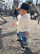 © phpetrunina14 - Toddler in white hoodie at playground on sunny day Portrait