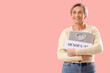 © Pixel-Shot - Mature woman holding weight scales with word MENOPAUSE on pink background