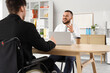 © Pixel-Shot - Male human resources manager interviewing job applicant in wheelchair at office