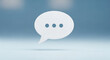 © Hay - White speech bubble with three dots on blue background symbolizing pause or conversation