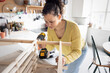 © ReeldealHD images - Woman Focused on DIY Project in Cozy Home Setting