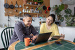 © ReeldealHD images - Roomies hanging out together using their digital devices