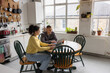 © ReeldealHD images - Students studying in their kitchen using technology