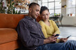 © ReeldealHD images - Couple Engaged in Phone Activity Together at Home