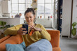 © ReeldealHD images - Young Woman Interacting with Phone and Credit Card