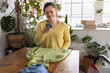 © ReeldealHD images - Young woman taking a photo to sell clothes online