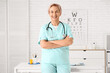 © Pixel-Shot - Happy mature female doctor with stethoscope in clinic