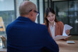 © Tj - Job applicant interviewing with human resources manager