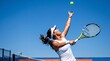 © TheseusStock - Female Tennis Player Serving on Outdoor Court under Bright Blue Sky