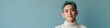 © Andrii Zastrozhnov - Young asian male smiling teal hair portrait casual turtleneck against blue background studio headshot confident expression