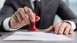 © photo for everything - Professional applies red seal on official document, demonstrating authority, approval, and official procedure for legal, business, and administrative tasks