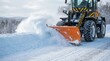 © Alamin - Orange snowplow clearing road of fresh white snow winter conditions driving cold weather