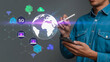 © MOSTFAOZIA - A man holding a smartphone with a stylus and a 5g network graphic