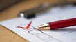 © photo for everything - Red Checkmark on a White Form with Pen on Wooden Desk: Task Completion, Survey Response, or Assessment Success