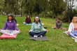 © Sabrina - Group of women with different ethnic and body doing yoga meditaiton at city park - Multiracial female circle, healthy lifestyle and mental health concept