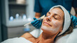 © Bonsales - Woman enjoying a spa facial treatment, experiencing a professional application of a purifying face mask for healthy skin