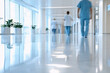 © maria_lh - Blurred background of hospital lobby with people walking around