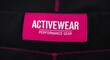 © SoulGTX - Close-up of black activewear pants with a pink tag; text reads 'Activewear Performance Gear