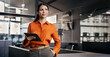 © Stock 4 You - Businesswoman CEO using fintech tab app standing at workplace in office. Latin Hispanic mature professional business woman holding digital tablet for trading, looking at camera copy space. Web banner