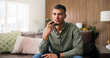 © peopleimages.com - Man, conversation and voice note with speaker phone for audio message or recording in home. Male person, talking or speaking with technology for chat, vocal app or discussion in house living room
