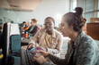 © Marko Geber - Students collaborating on computers in modern computer lab