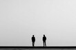 © Mykola - Two people stand far apart in emptiness. Space for text.