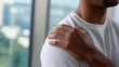 © Curioso.Photography - Man touching shoulder in pain highlighting muscle strain, injury and healthcare concept