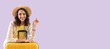 © Pixel-Shot - Happy young woman with suitcase on lilac background with space for text
