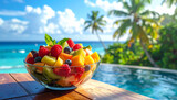 Fresh tropical fruit cocktail on a white plate served with a healthy green kiwi salad and sweet red berries in a beach bowl