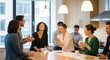 © Aman - Diverse colleagues enjoying coffee break in modern office kitchen