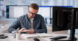 © Andrey Popov - Billing Specialist Analyzes Multiple Screens