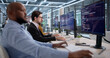 © Andrey Popov - Diverse Team Of Software Engineers Coding Security Programs In An Office