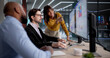 © Andrey Popov - Diverse Team Using Computers To Analyze Data And Manage Business Performance