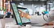 © Andrey Popov - Financial Analyst Reviewing Digital Data On Laptop Screen