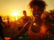 © Breezze - Cheerful young woman practicing yoga with friends on the beach at sunset, embracing a healthy lifestyle and wellness during golden hour with warm lens flare