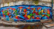 © hoc - Vibrant urban street graffiti art featuring abstract murals on a weathered grungy concrete wall within a gritty industrial city environment showcasing creative underground culture.