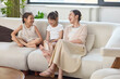 © Blue Jean Images - Mum hanging out with her daughters at home